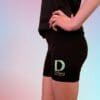 A person wearing black shorts and a black shirt