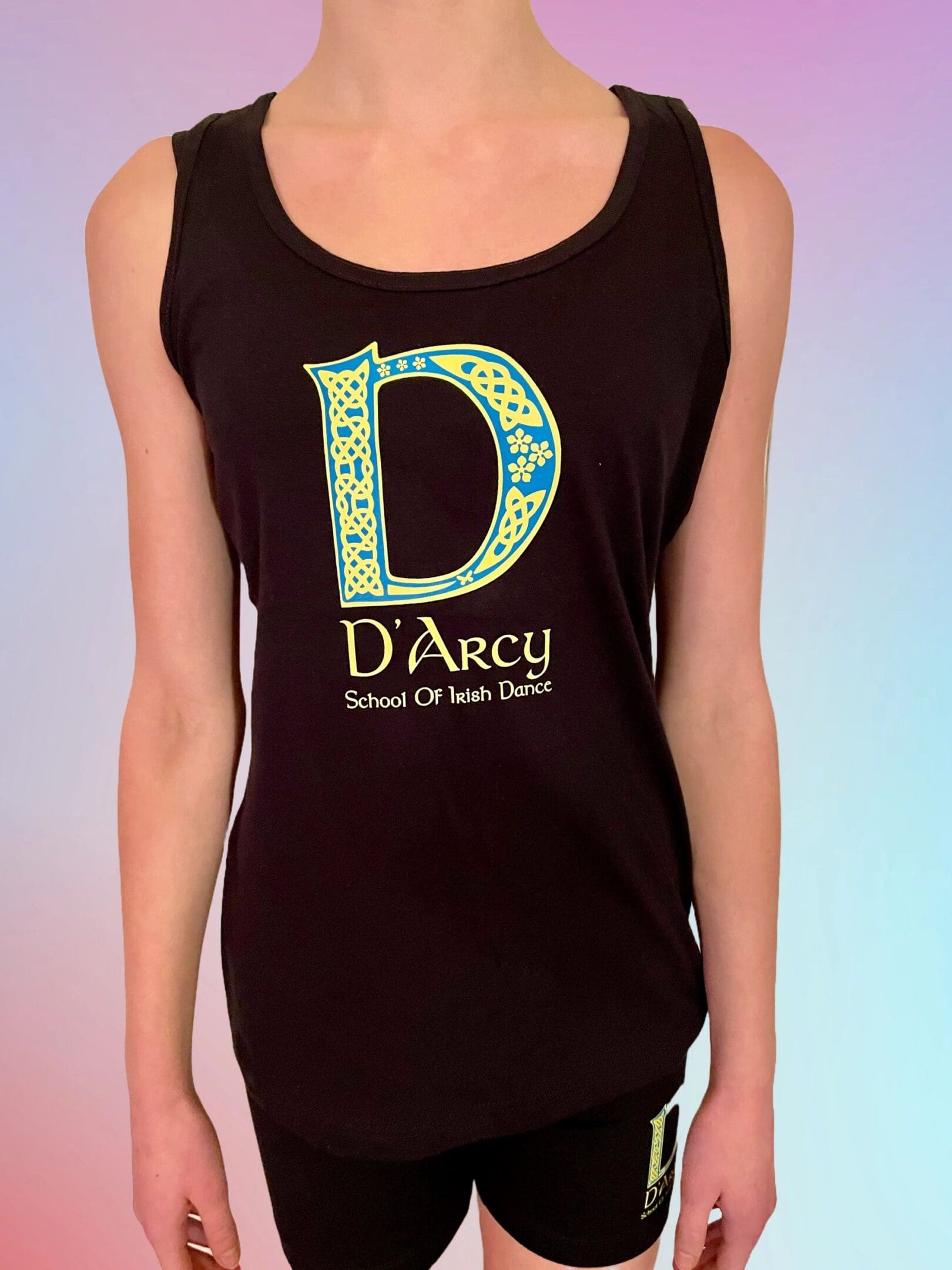 A woman wearing a black tank top with the letter d