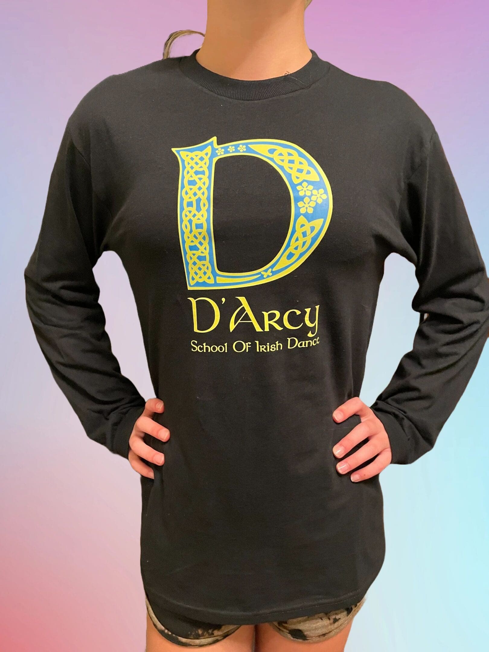 A man wearing a black long sleeve shirt with the letter d