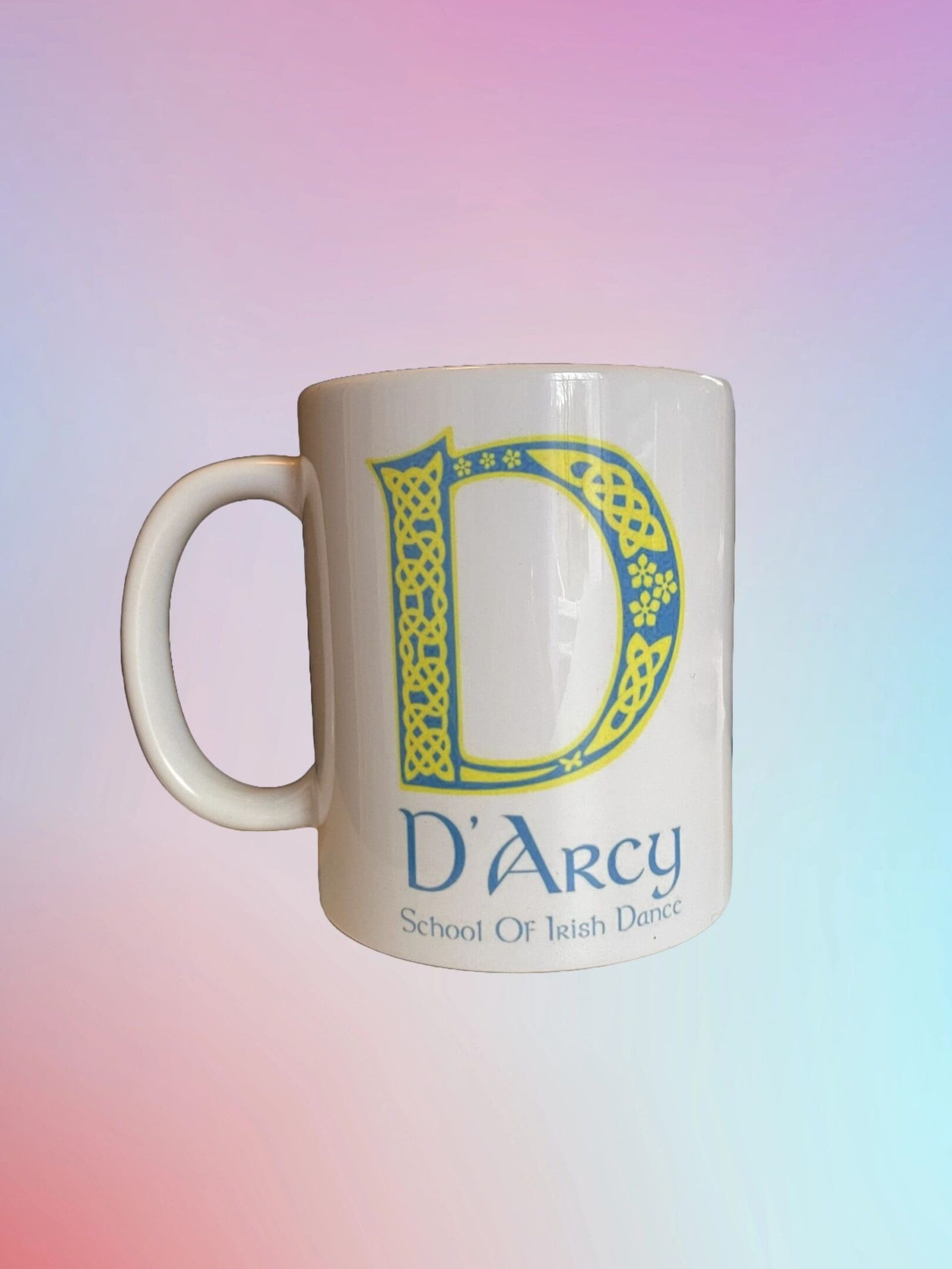 A mug with the letter d on it