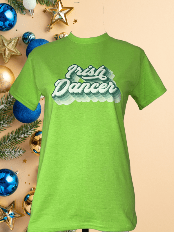 A green shirt with the words " irish dancer ".