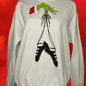A white sweatshirt with the grinch hanging from it's legs.